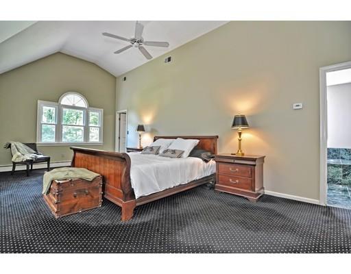 17 Deerfield Drive Medfield, MA 02052 - Photo 31 of 42 a bedroom with furniture a bed and a chandelier