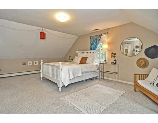 17 Deerfield Drive Medfield, MA 02052 - Photo 36 of 42 a spacious bedroom with a bed and a lamp on dresser