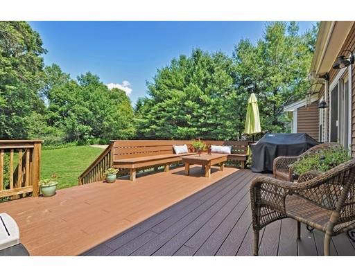 17 Deerfield Drive Medfield, MA 02052 - Photo 41 of 42 a backyard of a house with table and chairs