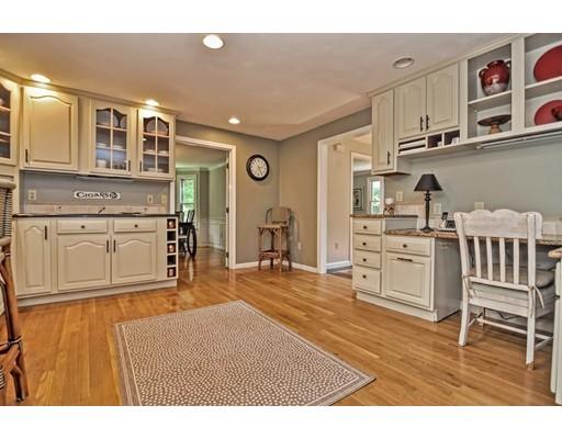 17 Deerfield Drive Medfield, MA 02052 - Photo 10 of 42 a living room with stainless steel appliances kitchen island granite countertop a cabinets and wooden floors