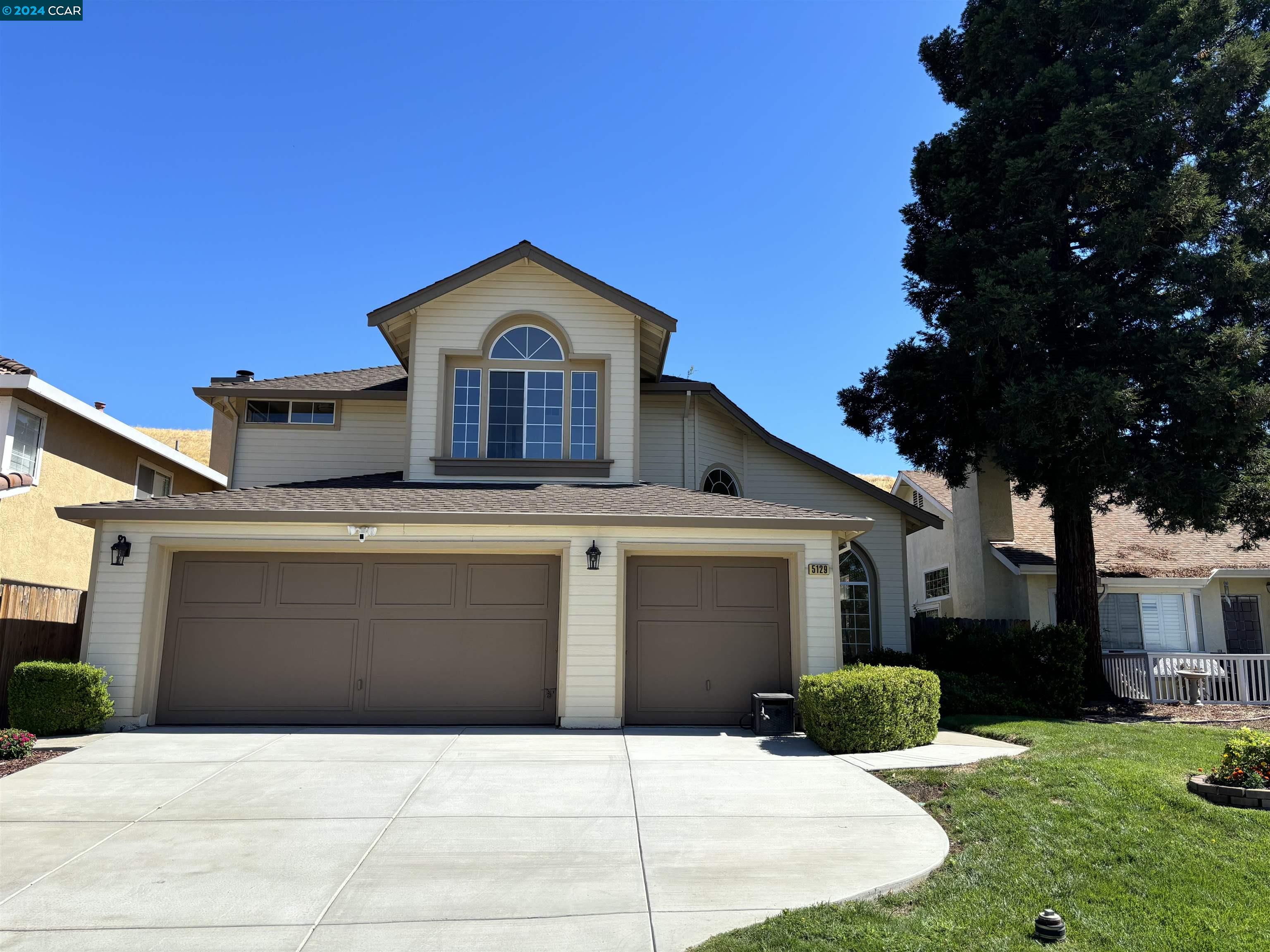 5129 Rodeo Court Antioch, CA 94531 - Photo 1 of 1 a front view of a house with a yard and garage