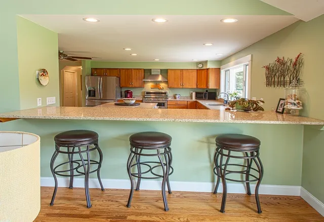 a view of a kitchen and dining room