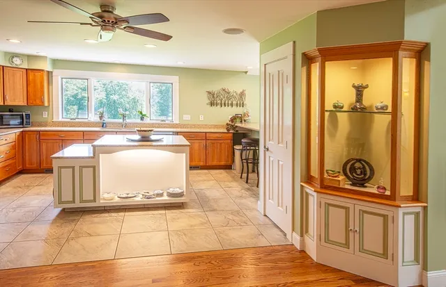 a room with a stove a sink and a refrigerator