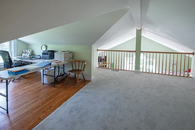 a view of a livingroom with furniture and wooden floor