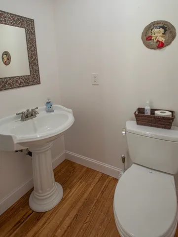 a bathroom with a toilet and a sink