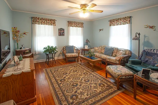 a living room with furniture and a rug