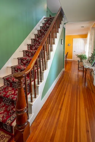 a view of entryway with wooden floor