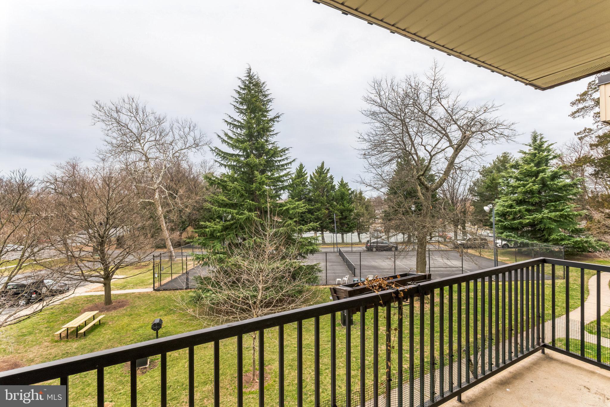 2101 Walsh View Terrace, Unit 17301 Silver Spring, MD 20902 - Photo 11 of 15 Balcony overlooking the grounds and tennis courts