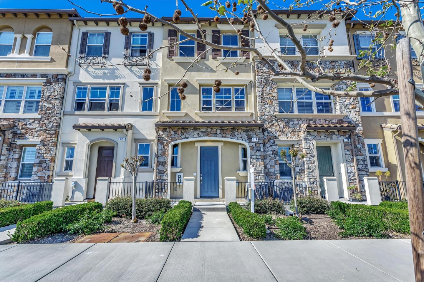 a view of a brick building next to a yard