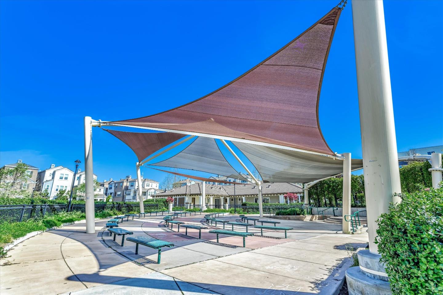 1367 Merry Loop Milpitas, CA 95035 - Photo 9 of 12 a patio with a table and chairs under an umbrella