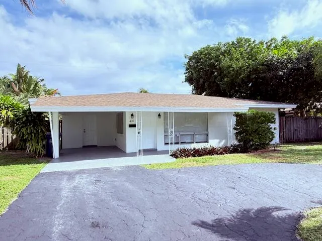 a view of a house with a yard and garage