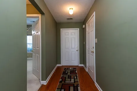 a view of bedroom with wooden floor