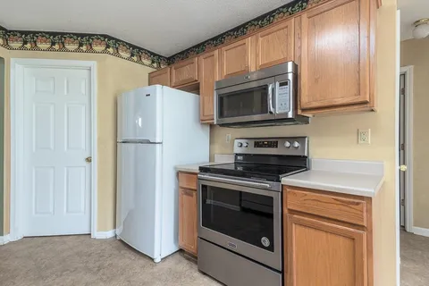 a kitchen with a stove microwave and refrigerator