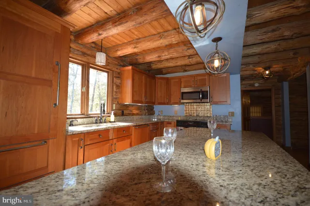 a very nice looking kitchen with a large window
