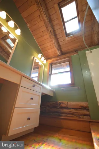 a view of a hallway with windows