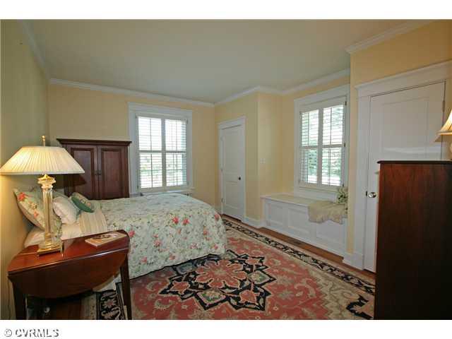 6005 Howard Road Richmond, VA 23226 - Photo 13 of 24 Master Bedroom - First floor front bedroom has two closets, window seat, plantation shutters and private full bath.