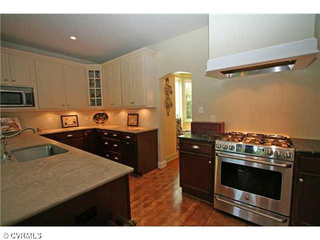 6005 Howard Road Richmond, VA 23226 - Photo 7 of 24 Kitchen - Designer kitchen features custom wood floor, painted & stained maple cabinetry, marble & soapstone counters, GE stainless gas stove with hood, Miele stainless dishwasher and stainless refrigerator!