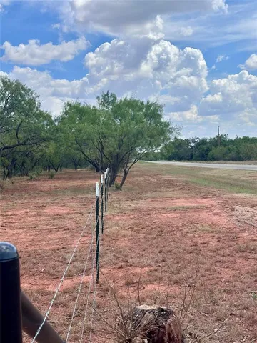 a view of a building with a yard