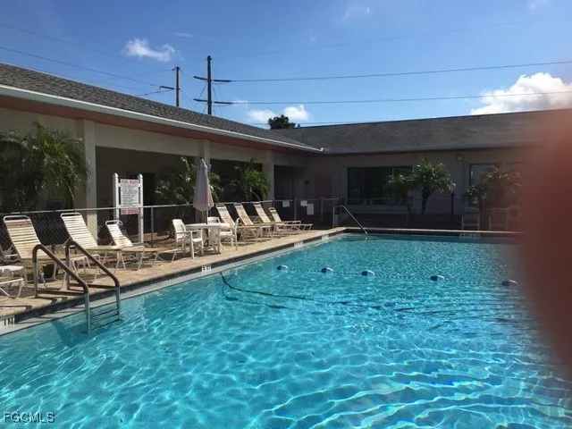 a view of a chairs and table in patio