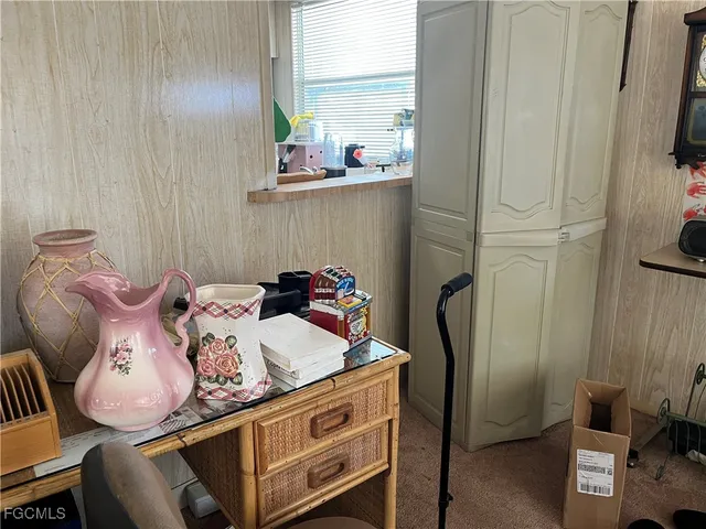 a bed room with a bed and a television