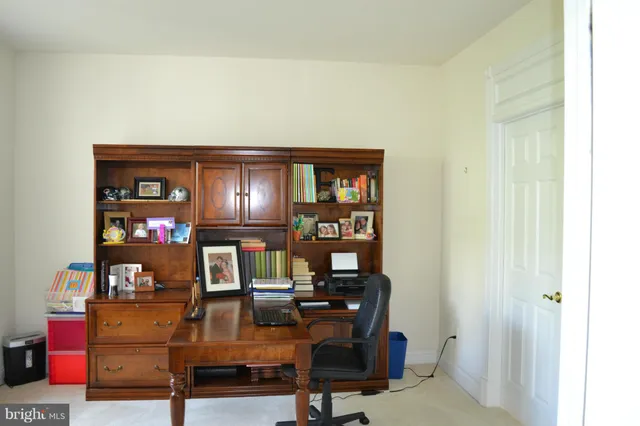 a view of a workspace with furniture