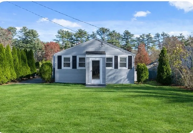 a front view of a house with a yard