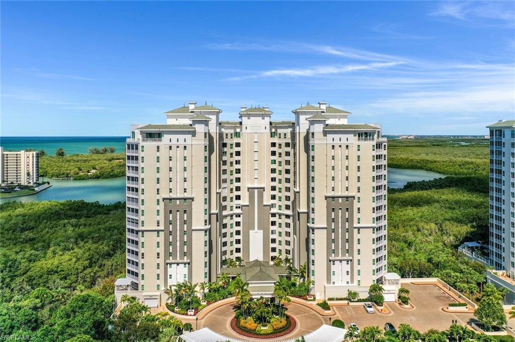 295 Grande Way, Unit 1202 Naples, FL 34110 - Photo 32 of 36 a view of a city with tall buildings