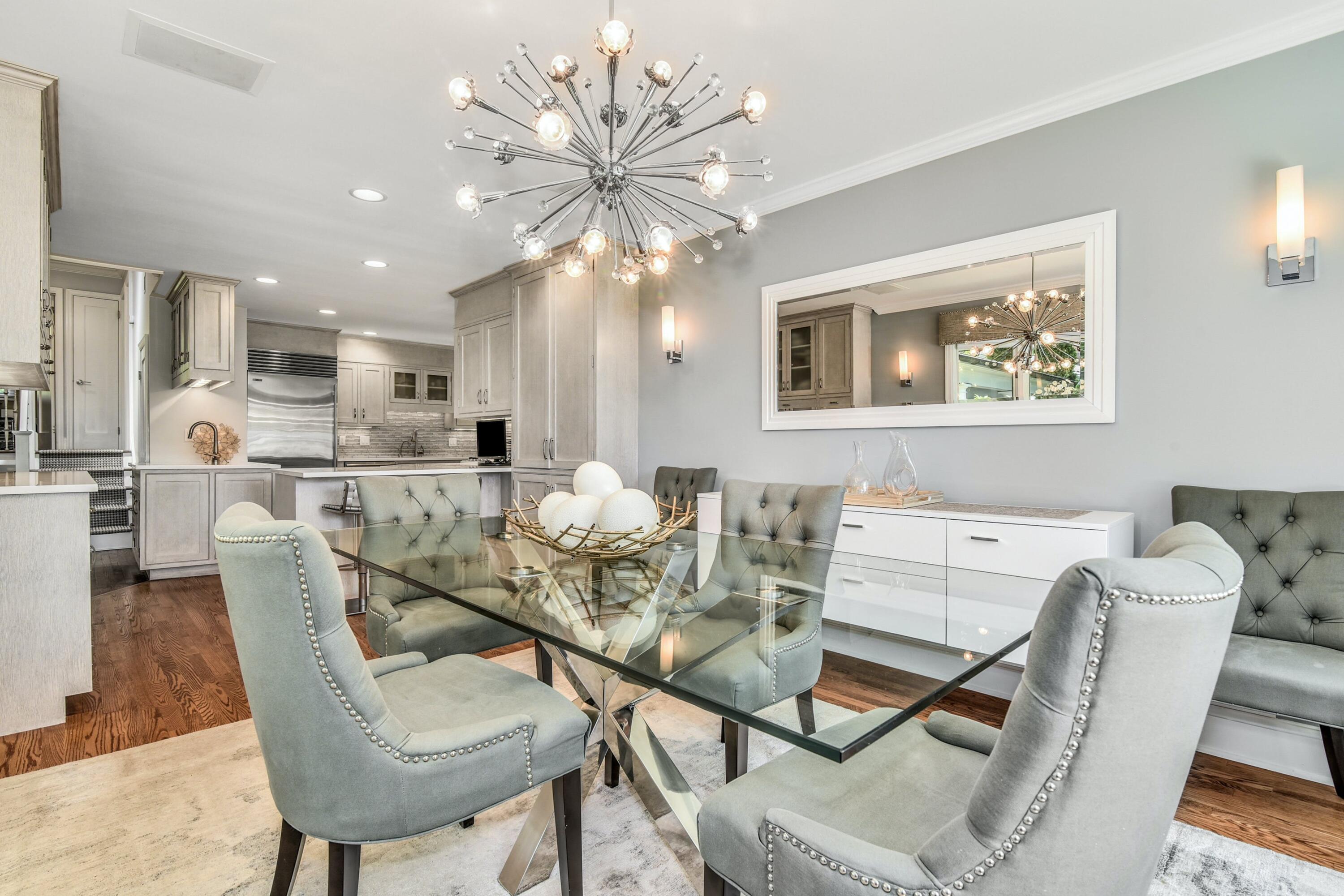 9 Top Sail Road Rowayton, CT 06853 - Photo 11 of 30 a dining room with furniture and chandelier
