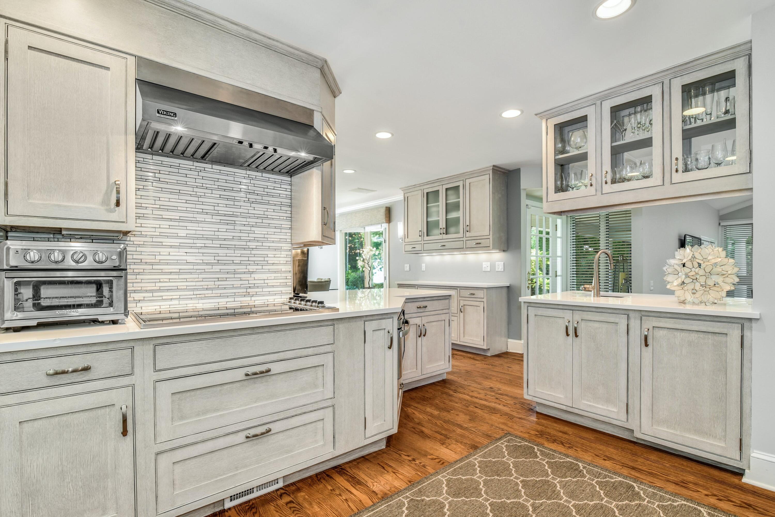 9 Top Sail Road Rowayton, CT 06853 - Photo 15 of 30 a kitchen with granite countertop white cabinets and white appliances