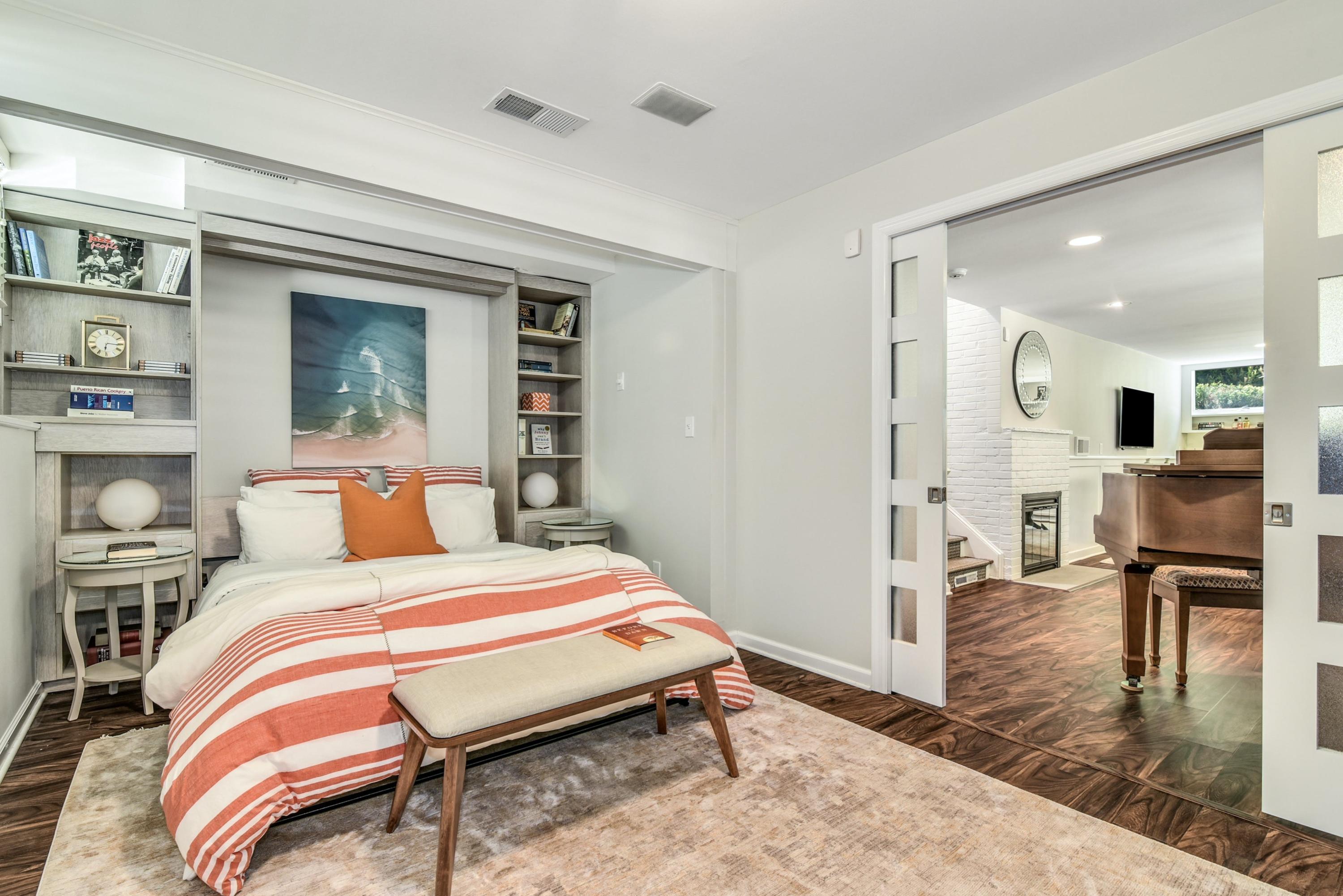 9 Top Sail Road Rowayton, CT 06853 - Photo 20 of 30 a bedroom with a bed and wooden floor