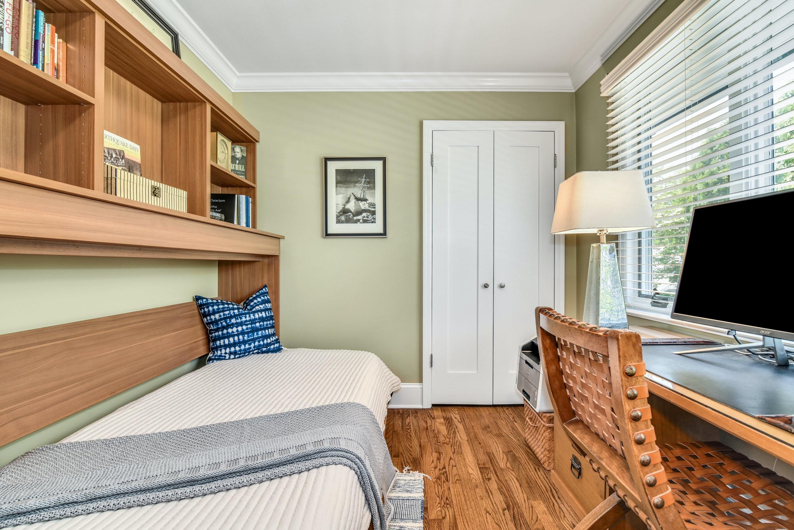 9 Top Sail Road Rowayton, CT 06853 - Photo 22 of 30 a bedroom with a bed and a flat screen tv