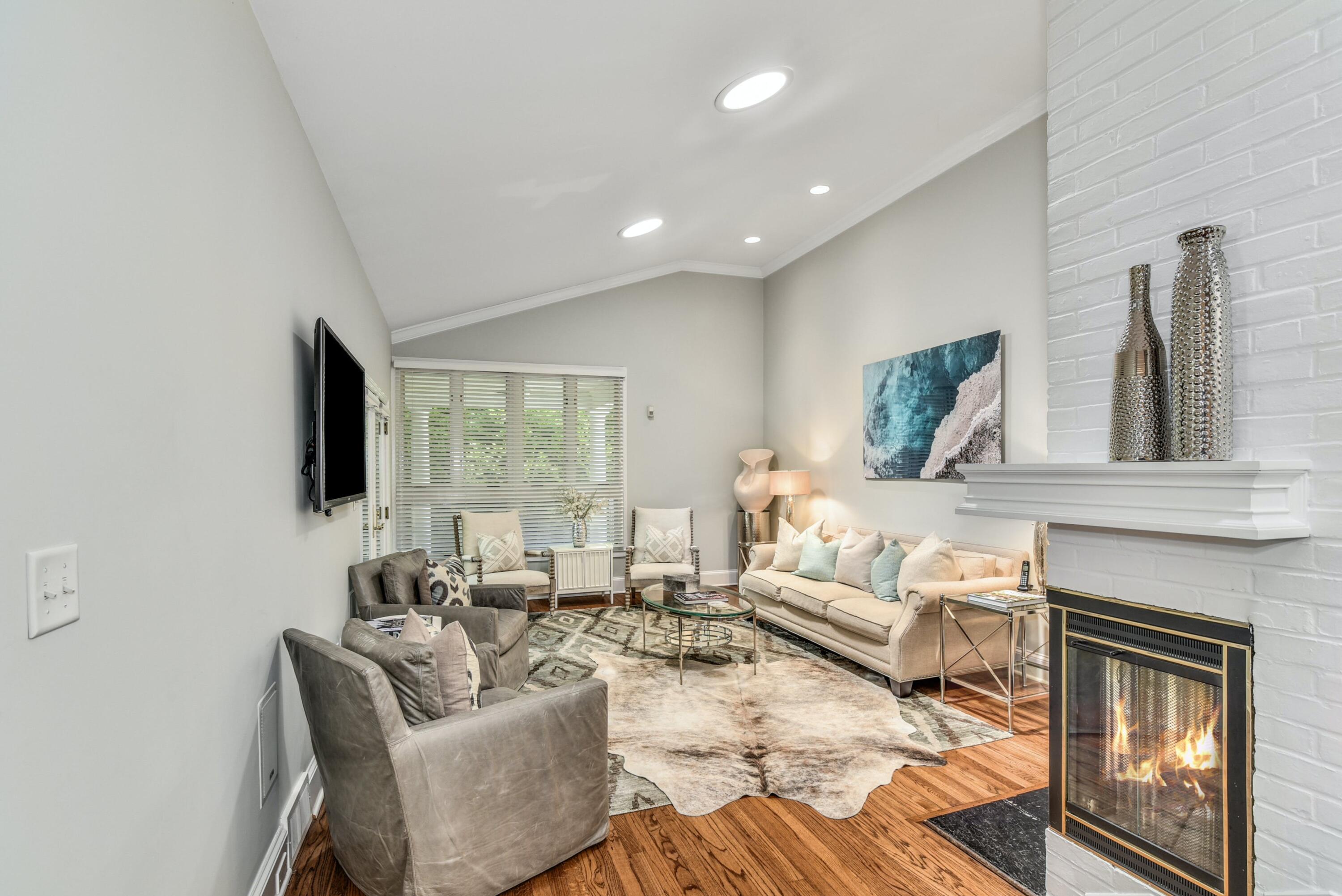 9 Top Sail Road Rowayton, CT 06853 - Photo 7 of 30 a living room with furniture fireplace and flat screen tv