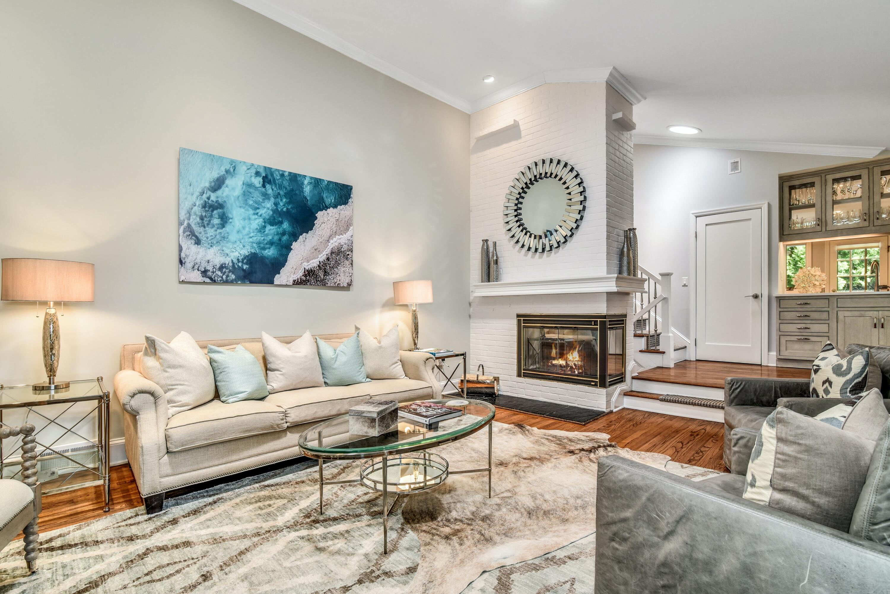 9 Top Sail Road Rowayton, CT 06853 - Photo 8 of 30 a living room with furniture a fireplace and a large window