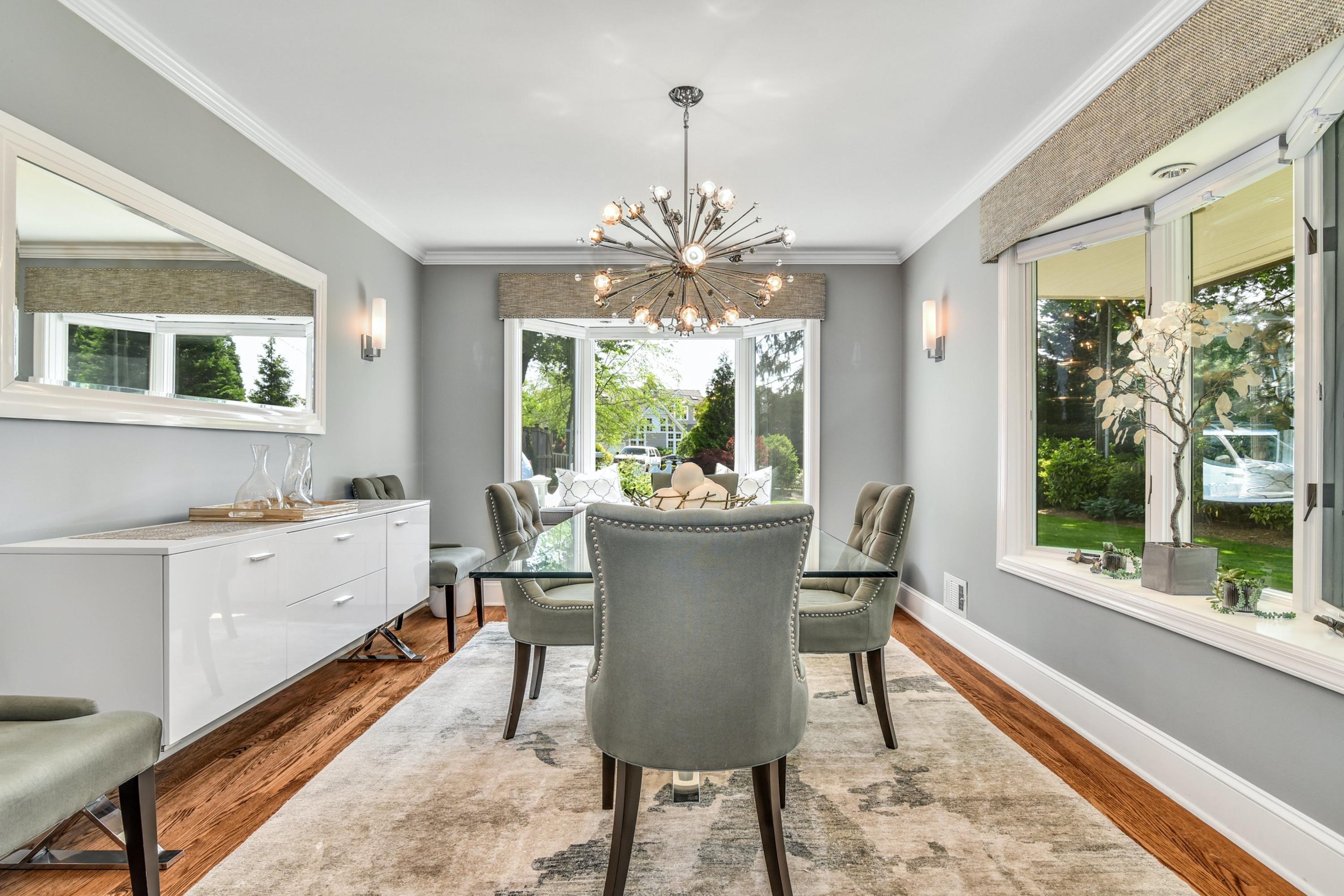 9 Top Sail Road Rowayton, CT 06853 - Photo 9 of 30 a view of a dining room with furniture a chandelier and wooden floor
