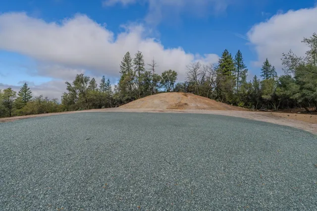a view of a lake with a yard