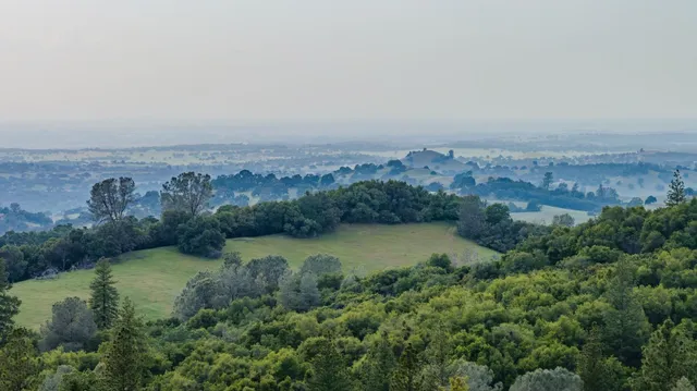 an aerial view of a house with outdoor space swimming pool