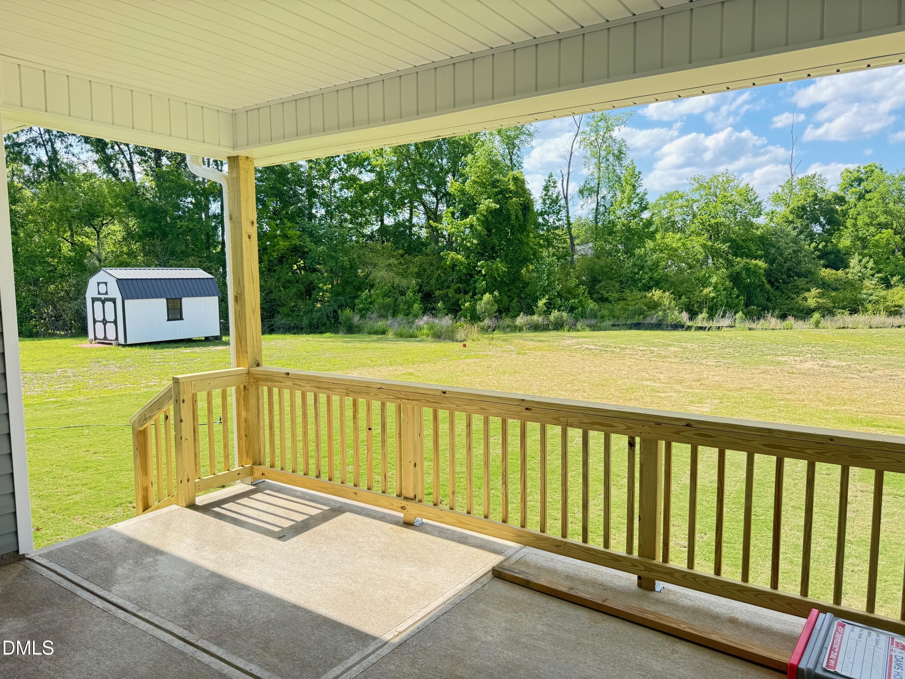 20 Streamline Court Lillington, NC 27546 - Photo 27 of 46 a view of a balcony with floor to ceiling windows and yard