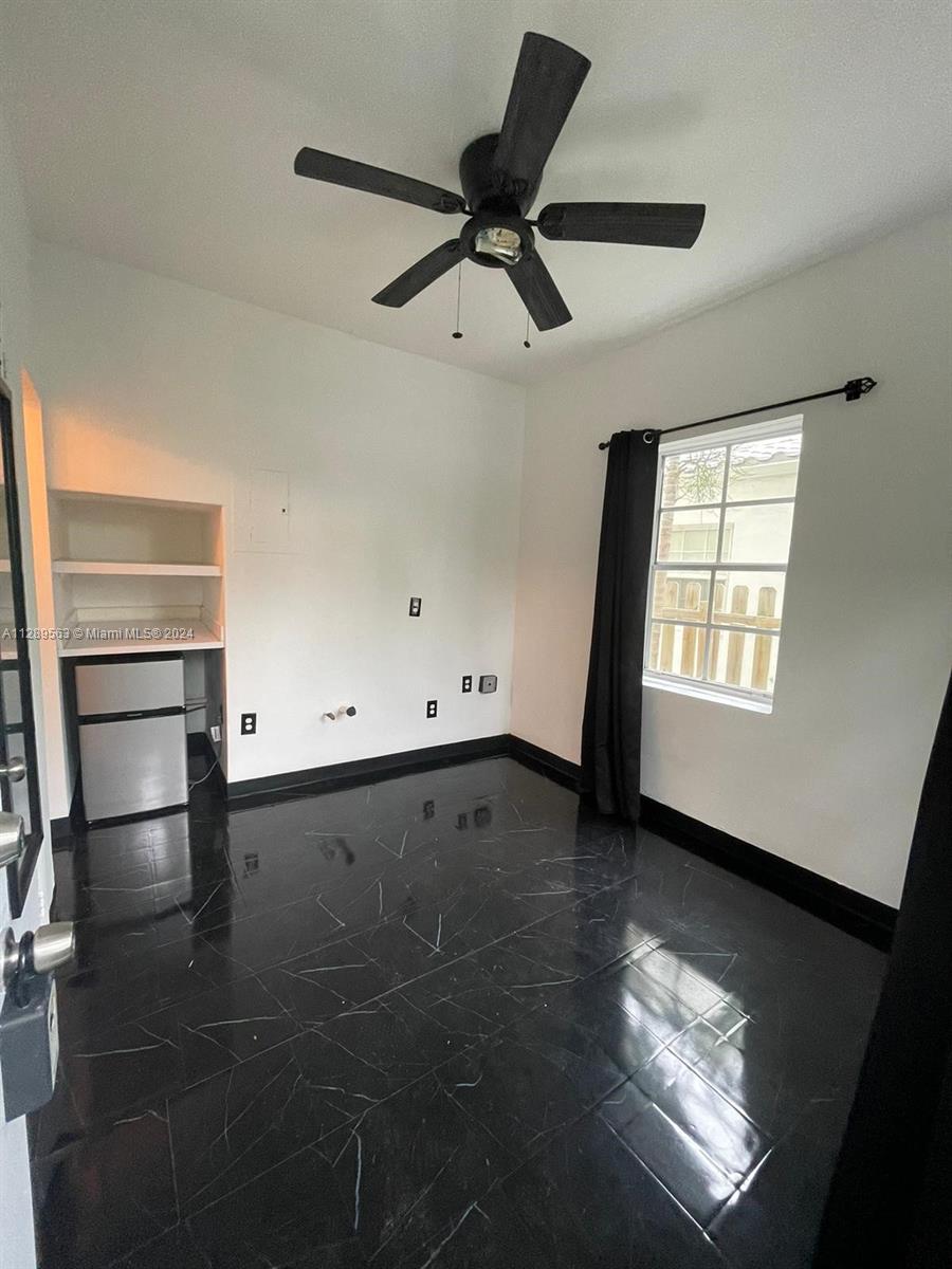 1455 Michigan Avenue, Unit 7 Miami Beach, FL 33139 - Photo 3 of 12 a view of an empty room with a window