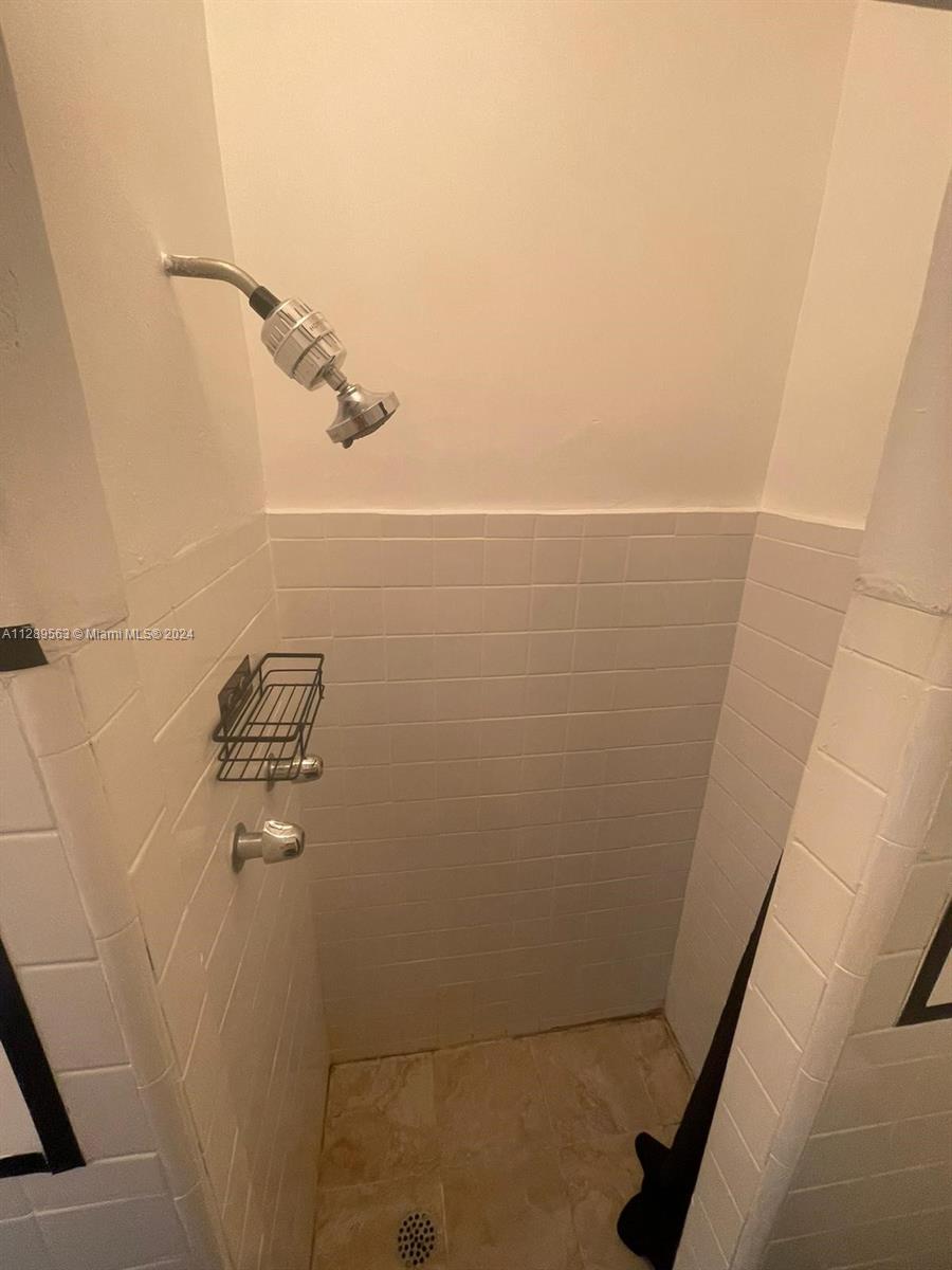 1455 Michigan Avenue, Unit 7 Miami Beach, FL 33139 - Photo 7 of 12 a bathroom with a shower