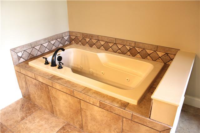 2064 Autumn Ridge Way Spring Hill, TN 37174 - Photo 8 of 14 Tiled master bathtub is separate from tiled master shower.