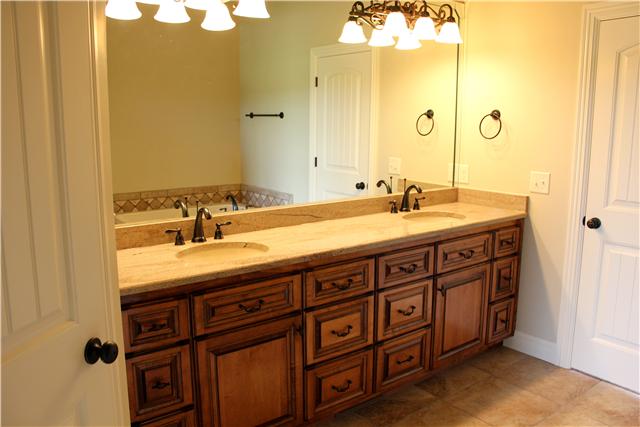 2064 Autumn Ridge Way Spring Hill, TN 37174 - Photo 9 of 14 His and hers sinks in the master bathroom feature granite counter tops.