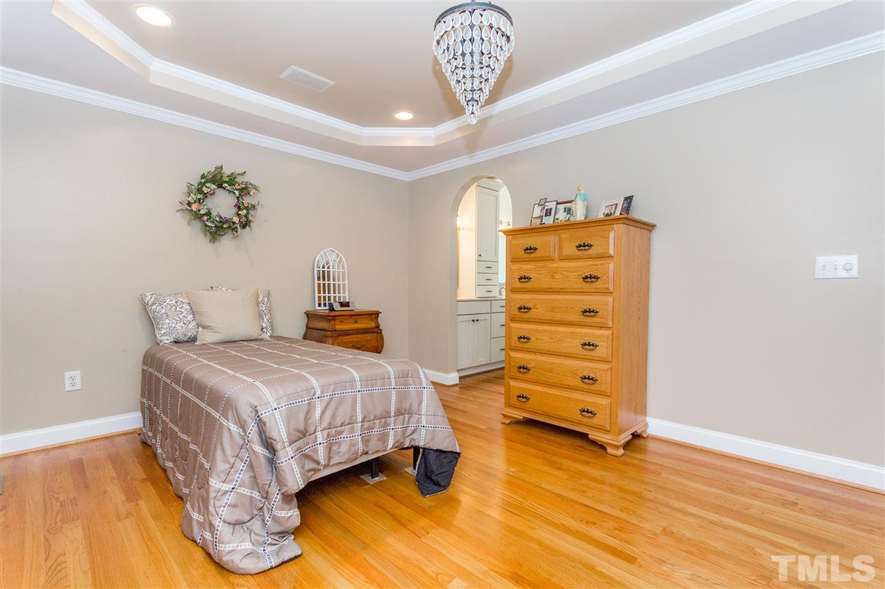 5321 Old Stage Road North Angier, NC 27501 - Photo 14 of 25 a bedroom with a bed and wooden floor