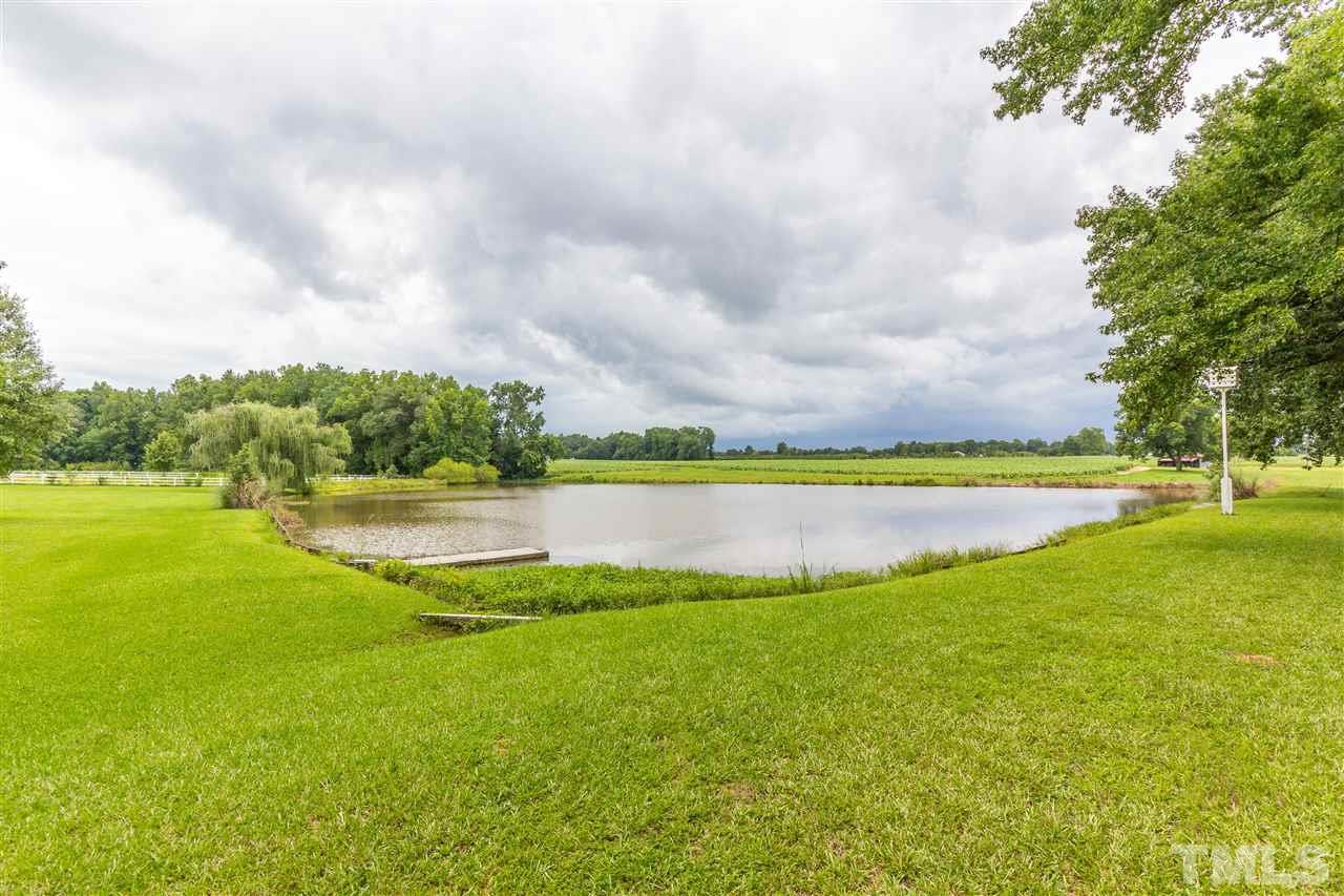 5321 Old Stage Road North Angier, NC 27501 - Photo 3 of 25 a view of a lake with a big yard