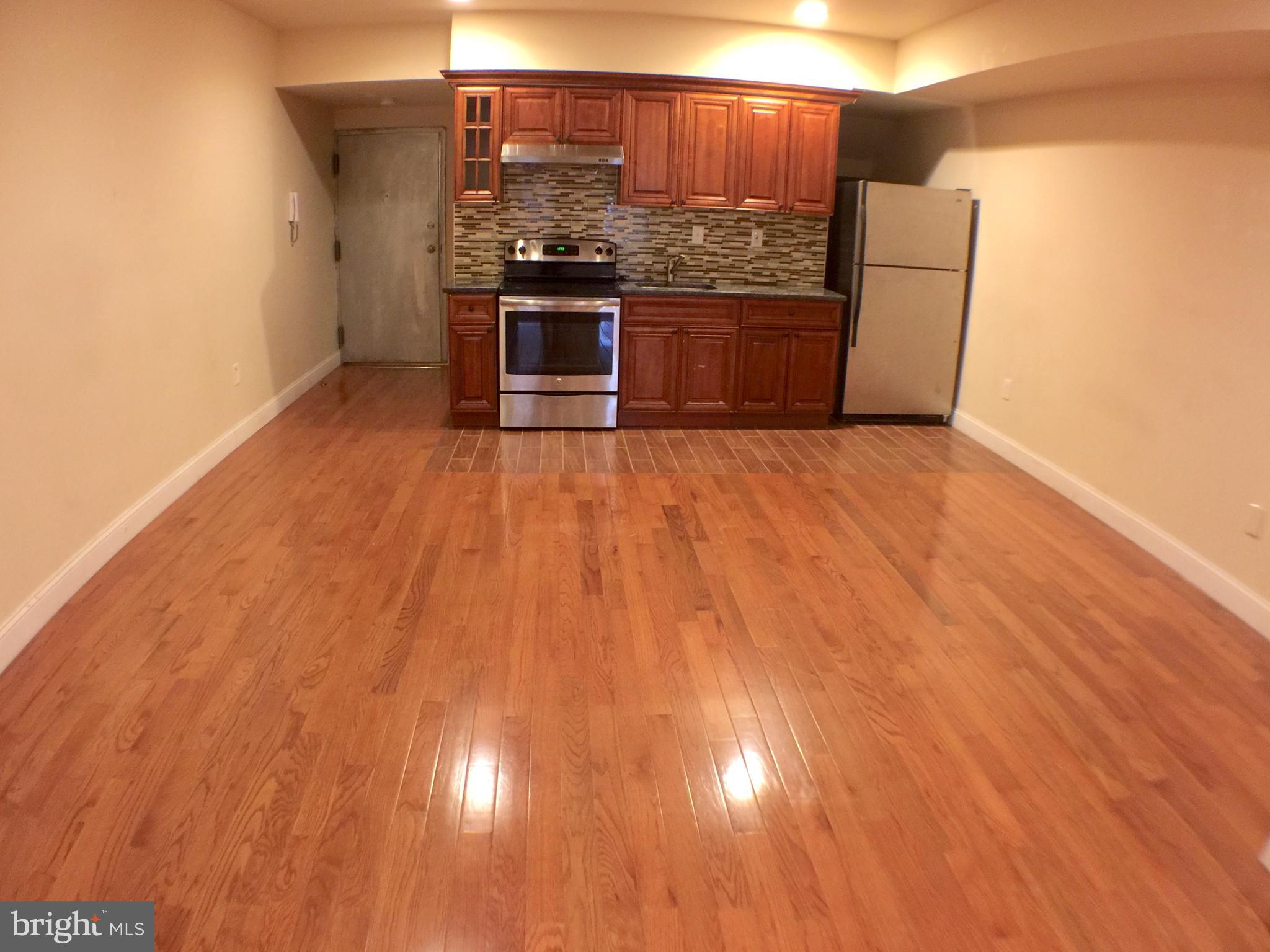 1241 Vine Street, Unit 2R Philadelphia, PA 19107 - Photo 2 of 7 a view of a room with wooden floor
