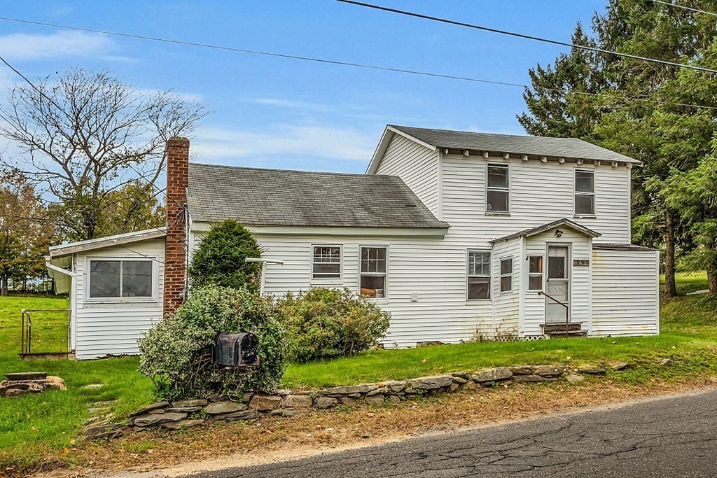 369 Old Northfield Road Ashby, MA 01431 - Photo 1 of 24 front view of a house with a yard