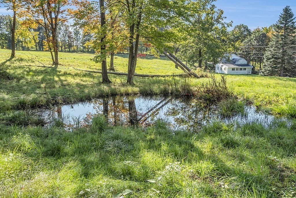 369 Old Northfield Road Ashby, MA 01431 - Photo 21 of 24 a view of a lake with a yard