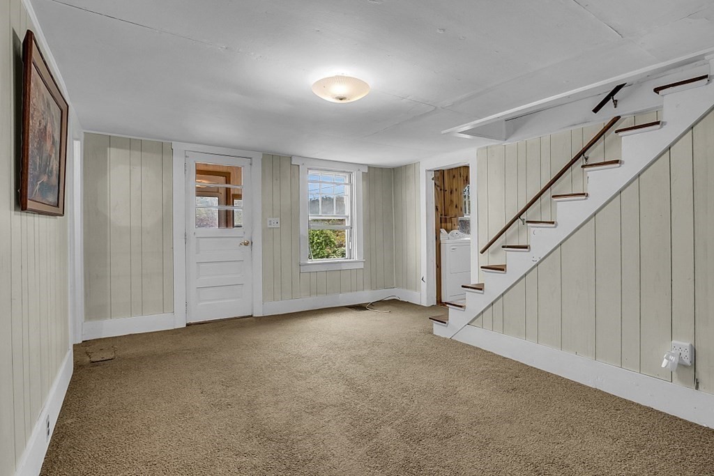 369 Old Northfield Road Ashby, MA 01431 - Photo 7 of 24 a view of an empty room with stairs
