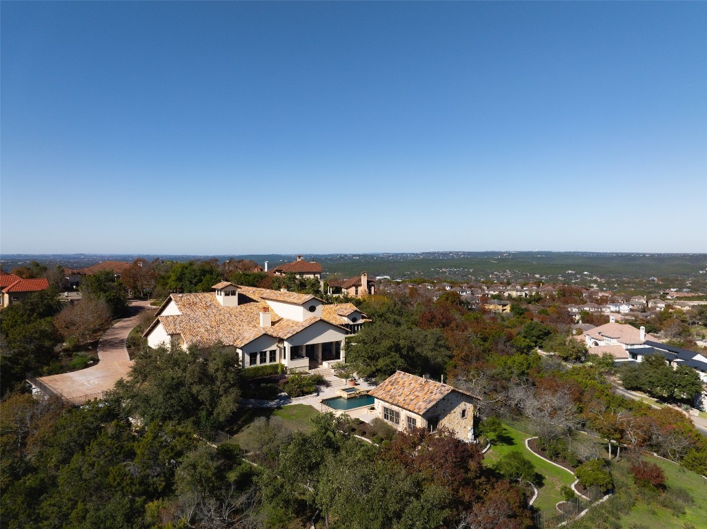 an aerial view of residential building and trees