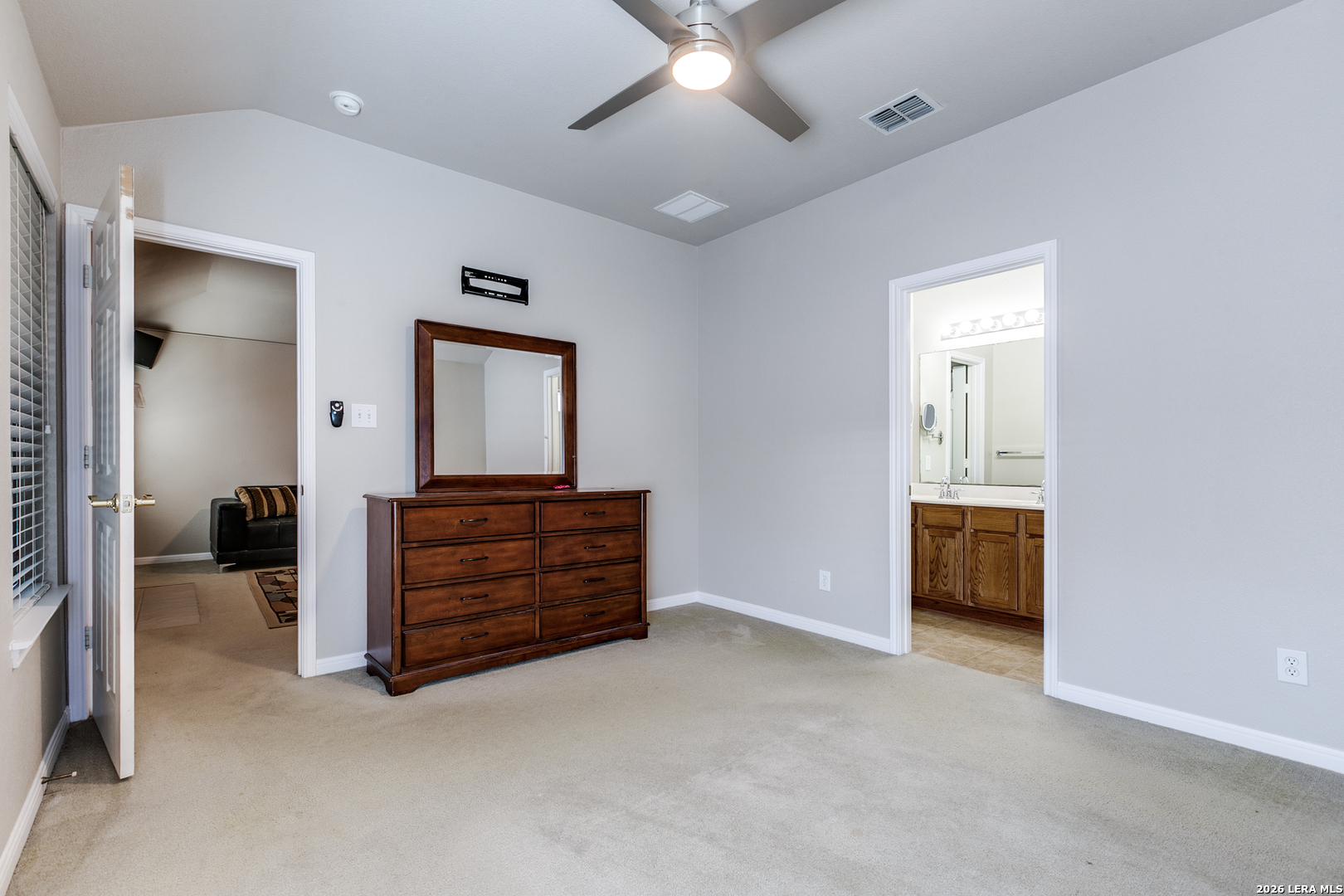 6822 Freedom Ridge San Antonio, TX 78242 - Photo 15 of 25 wooden floor with an empty room and a ceiling fan