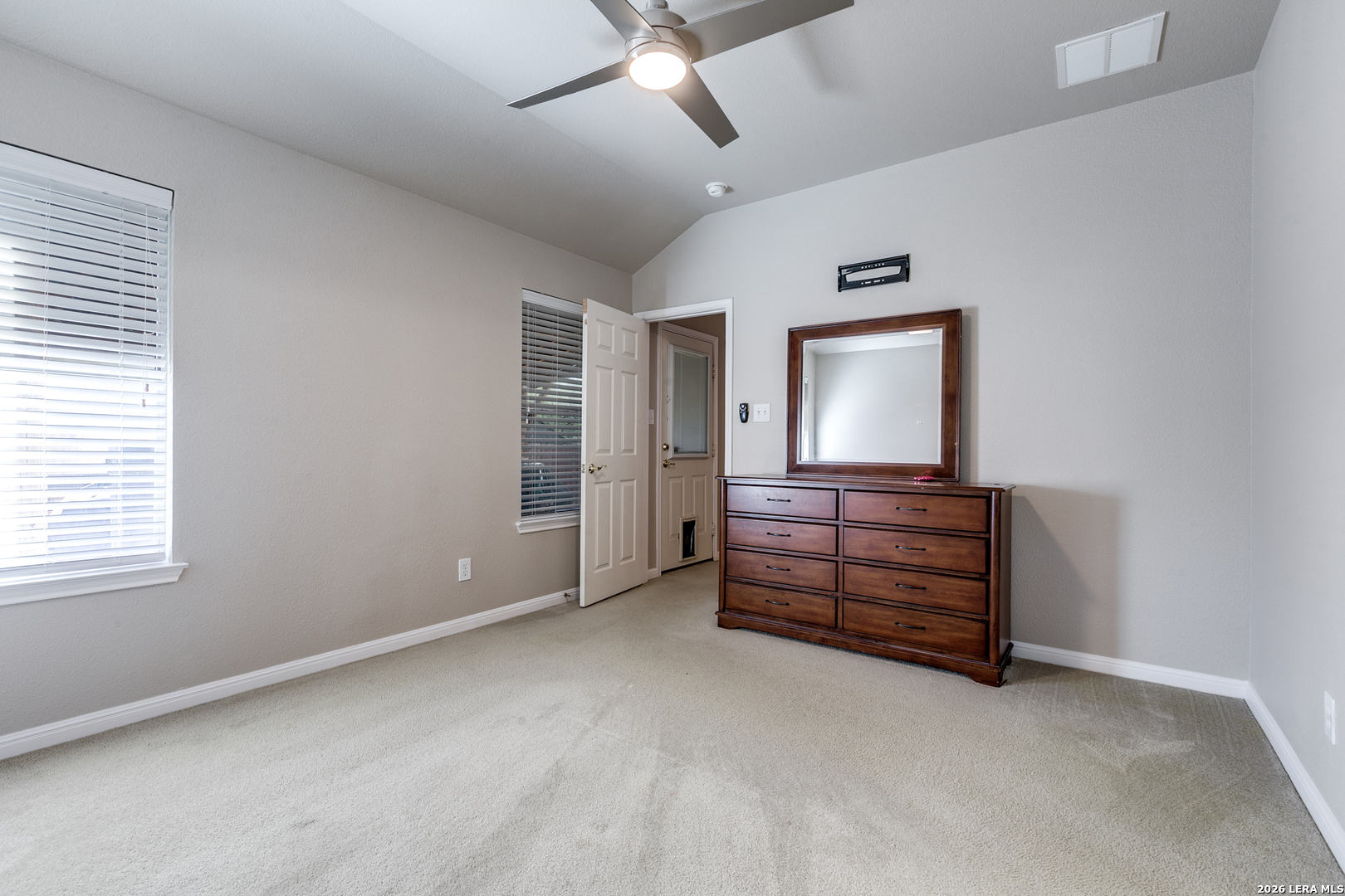 6822 Freedom Ridge San Antonio, TX 78242 - Photo 16 of 25 wooden floor in an empty room with a window